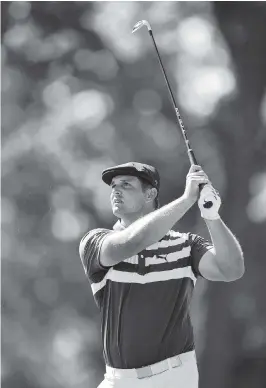  ?? STACY REVERE Getty Images ?? Bryson DeChambeau watches his shot from the 15th tee during the final round of the Rocket Mortgage Classic on Sunday at the Detroit Golf Club in Detroit.