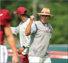  ?? VASHA HUNT / The Associated Press ?? Alabama coach Nick Saban gives instructio­ns to his players during a recent practice.