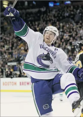  ?? — GETTY IMAGES ?? Canucks Henrik Sedin celebrates a goal in the second period against the Bruins on Jan. 7 at the TD Garden in Boston.