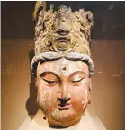  ??  ?? A wooden sculpture of Guanyin head from the Song Dynasty (960-1279).