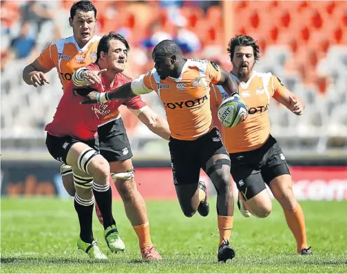  ?? Picture: GETTY IMAGES ?? RUNNING THE RHULE: Cheetahs try scorer Raymond Rhule escapes the attention of Franco Mostert during yesterday’s Super Rugby clash in Bloemfonte­in