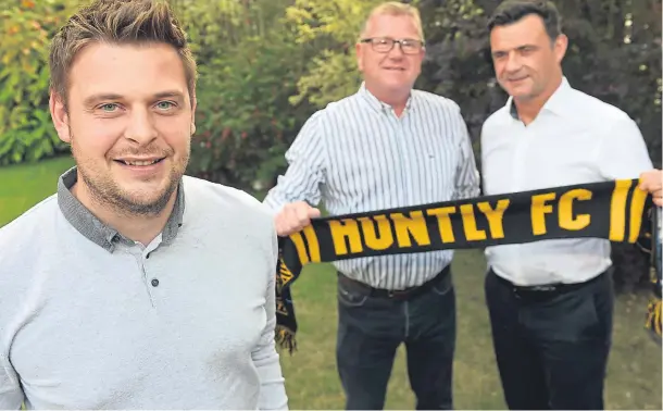  ??  ?? HOTSEAT AT LAST: Martin Skinner, left, is relishing his new role at Huntly, while assistant Ricky Cheyne, right, and Huntly director of football Steve Innes look on