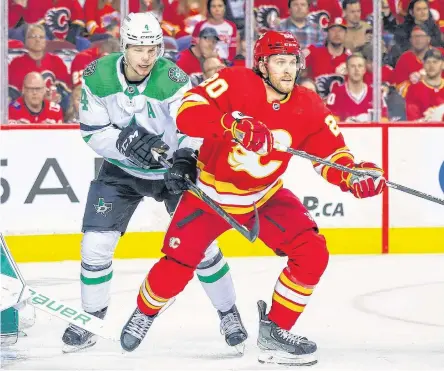  ?? USA TODAY SPORTS ?? Calgary Flames centre Blake Coleman and Dallas Stars defenceman Miro Heiskanen fight for position during the second period in Game 2 of the first round of the 2022 Stanley Cup playoffs at Scotiabank Saddledome.