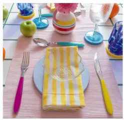  ?? ?? Lindsey has set the table with cutlery from John Lewis & Partners, napkins from Olive & Betty and colourful coasters from Etsy