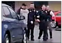  ?? Special to the Democrat-Gazette ?? An image from a Little Rock police dashboard video camera shows officer Charles Starks being escorted from the scene of the Feb. 22 shooting that left Bradley Blackshire dead.