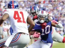  ?? BILL WIPPERT/THE ASSOCIATED PRESS ?? Bills’ Robert Woods is taken down hard Sunday at Ralph Wilson Stadium.