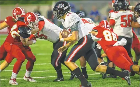  ?? Photograph­s by Mark Boster For The Times ?? CARTER FREEDLAND, quarterbac­k for Centennial, scrambles for extra yardage. Freedland ran for two touchdowns during the game.