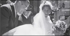  ?? ASSOCIATED PRESS ?? Peter O’Malley, president of the Los Angeles Dodgers, helps his bride, Annette Zacho, into a car following their wedding in Copenhagen, Denmark, July 10, 1971.