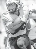  ?? ?? Transfer QB John Plumlee, who broke 1,000 yards rushing at Ole Miss in 2019, runs during Saturday’s spring game.