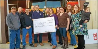  ?? GIL COHEN — FOR DIGITAL FIRST MEDIA ?? MOMS Club President Michelle Diamond presents check to Chief Michael Zomolsky of Amity Fire Rescue Company.