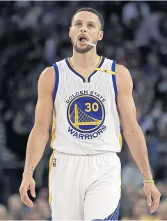  ?? AP ?? The Warriors’ Stephen Curry looks at the scoreboard during the first half.