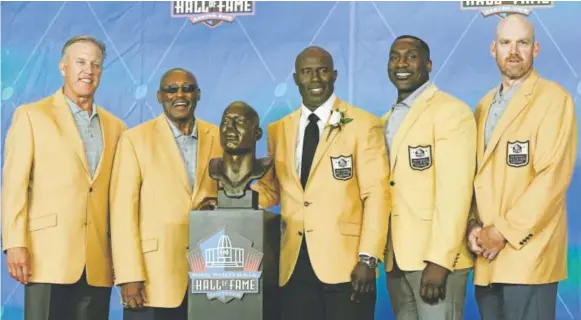  ?? John Leyba ,T he Denve rp ost ?? Broncos Hall of Famers John Elway, Floyd Little, Shannon Sharpe and Gary Zimmerman pose with new member Terrell Davis after Davis’ induction speech at the Pro Football Hall of Fame enshrineme­nt ceremony in Canton, Ohio, on Saturday night. “I am...