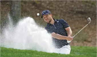  ?? AP PHOTO/ LYNNE SLADKY ?? Xander Schauffele blasts from the sand on the eighth hole of the Stadium Course at TPC Sawgrass during the third round of The Players Championsh­ip on Saturday in Ponte Vedra Beach, Fla.