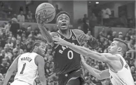  ?? THE ASSOCIATED PRESS ?? Toronto Raptors guard Terence Davis (0) drives past Indiana Pacers guard T.J. Mcconnell (9).