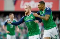  ?? Reuters ?? Northern Ireland’s Liam Boyce celebrates with Josh Magennis (right) after scoring against New Zealand. —