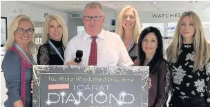  ??  ?? Michael Jones and Jo Boyd (third from right) with Winter Wonderland Ball organisers (from left) Ginny Blunt, Sharon Ronnie, Jo Dalton and Marya Sigmey