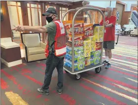  ?? SUBMITTED PHOTO ?? Red Cross volunteers move supplies into a Red Cross shelter at a hotel in Philadelph­ia on Thursday.