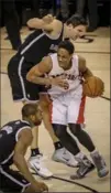  ?? DAVID COOPER, TORONTO STAR ?? Raptors guard DeMar DeRozan looks for an opening Tuesday night.