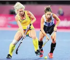  ??  ?? Ball control Australia’s Casey Eastham (left) controls the ball during her team’s goalless draw with Argentina on Monday.
AP