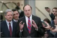  ?? J. SCOTT APPLEWHITE — THE ASSOCIATED PRESS ?? From left, Sen. John Hoeven, R-N.D., Rep. Tom Graves, R-Ga., and Sen. Richard Shelby, R-Ala., the top Republican on the bipartisan group bargainers working to craft a border security compromise in hope of avoiding another government shutdown, speak with reporters after a briefing with officials about the US-Mexico border, on Capitol Hill in Washington, Wednesday.