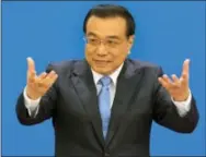  ?? AP PHOTO/NG HAN GUAN ?? Chinese Premier Li Keqiang speaks at a press conference after the closing session of the National People’s Congress at the Great Hall of the People in Beijing. Li is due to arrive in the Australian capital Canberra on Wednesday, on a mission to expand...