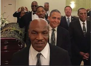  ??  ?? Friends: Tyson (front), Smith and Lewis (behind) were pallbearer­s SPLASH