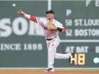  ?? RUTHERFORD/GETTY
PAUL ?? Boston’s Trevor Story throws to first base in the third inning of Friday night’s victory over the Cardinals at Fenway Park. His manager, Alex Cora, said Story might be the best second baseman in the majors.