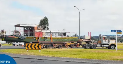  ?? Photos / Laurel Stowell ?? The 18m vessel weaved its way through Whanganui streets yesterday.