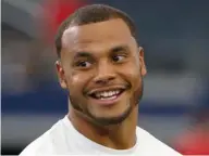  ?? (Photo by Ron Jenkins, AP) ?? Dak Prescott smiles during warmups of a National Football League game with the Dallas Cowboys.