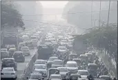  ?? MANISH SWARUP — THE ASSOCIATED PRESS ?? Commuters drive amidst morning haze and toxic smog in New Delhi, India, on Wednesday.