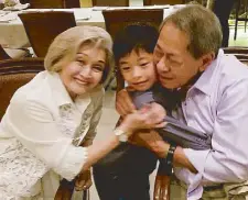  ??  ?? Ed Angara with wife Gloria and grandson Javier, the youngest son of Sonny and Tootsy. Ed and Javier were in Hong Kong a week before the senator passed away.