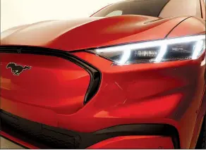  ?? AP/CARLOS OSORIO ?? Ford Motor Co. on Sunday unveiled the new Mustang Mach-E, one of 40 electric and hybrid models the company wants to introduce by 2022.