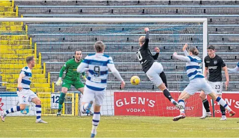  ??  ?? MARKSMAN: Russell Mclean scores for Montrose against Morton at Cappielow last night.