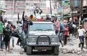 ?? DANIEL IRUNGU/EPA ?? Supporters of opposition leader Raila Odinga protest the killing of a girl Saturday in Nairobi. A watchdog group said police gunfire has killed 24 people since Tuesday’s vote.