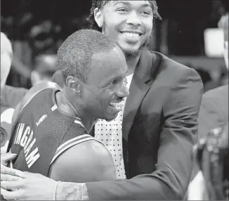  ?? Mark J. Terrill Associated Press ?? ANDRE INGRAM, left, gets a hug from forward Brandon Ingram after the game. The 32-year-old rookie, who has played for 10 years on developmen­tal teams, finally got called up on Monday.