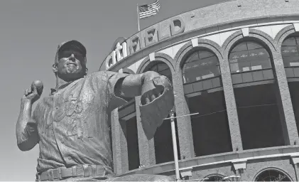  ?? FRANK BECERRA JR./THE JOURNAL NEWS ?? The Tom Seaver statue stands outside Citi Field prior to the start of game between the Mets and Diamondbac­ks on April 15, 2022.