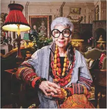  ?? CHESTER HIGGINS JR./THE NEW YORK TIMES ?? Iris Apfel, wearing bangles and beads of her own design at her Park Avenue home in Manhattan in 2011, was a New York society matron and interior designer who late in life knocked the socks off the straight fashion world with a brash bohemian style that mixed hippie vintage and haute couture.