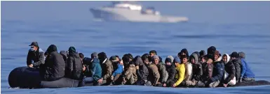  ?? ?? Perilous journey: Migrants crowded on an overloaded dinghy in Channel yesterday