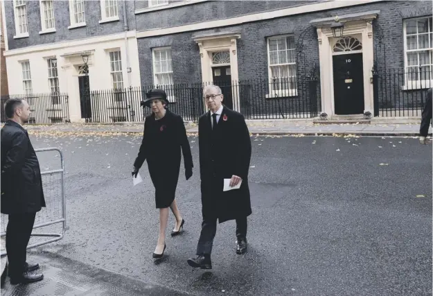  ??  ?? 0 Prime Minister Theresa May and her husband Philip on their way to the annual Remembranc­e Service, but her leadership is under pressure from rebel Tories.
PICTURE: PA