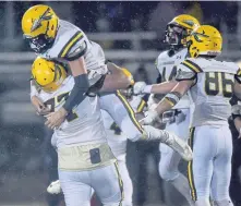  ??  ?? RISING TO CHALLENGE AGAIN: King Philip players celebrate their 10-7 victory against Mansfield in last night’s Division 2 South championsh­ip game.