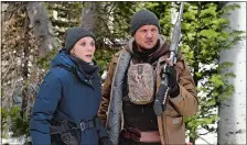  ?? FRED HAYES/THE WEINSTEIN COMPANY ?? Elizabeth Olsen and Jeremy Renner star in “Wind River.”