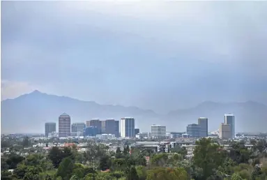  ?? DAVID WALLACE/THE REPUBLIC ?? Clouds fill the sky over downtown Phoenix on Tuesday.