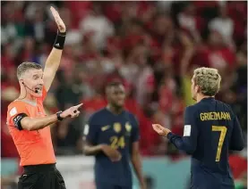  ?? Photo / AP ?? Kiwi referee Matthew Conger (left) ruled out the French equaliser by Antoine Griezmann (right) following a video review.