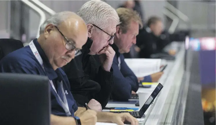  ?? DAVID BLOOM ?? Scouts prepare for the Canada and Switzerlan­d game Monday at Rogers Place during the Hlinka Gretzky Cup, the first big tournament of the year for draft-eligible players.