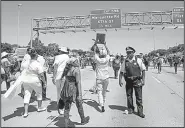  ?? AP/Chicago Sun-Times/ASHLEE REZIN ?? People gather Saturday on Interstate 94 in Chicago for a protest against gun violence.