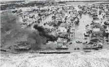  ?? David J. Phillip / Associated Press file ?? Damage on Galveston Island during Hurricane Ike inspired the proposal for an “Ike Dike,” or coastal barrier system.