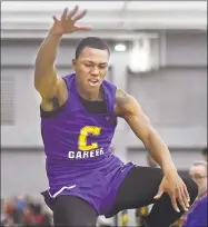  ?? Catherine Avalone / Hearst Connecticu­t Media ?? Career senior Dyshon Vaughn wins the long jump with a distance of 23-08 1/2 at the CIAC Boys Indoor Track & Field State Open on Feb. 17 at Floyd Little Athletic Center at Hillhouse High School in New Haven.