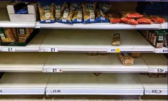  ??  ?? Penne dreadful: Many pasta shelves are bare at Tesco Extra in Bolton