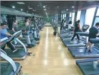  ??  ?? People exercise at a gym in Shanghai. About 15 million Chinese had gym membership­s and the fitness market reached 30 billion yuan ($4.35 billion) last year, according to iResearch Consulting Group.