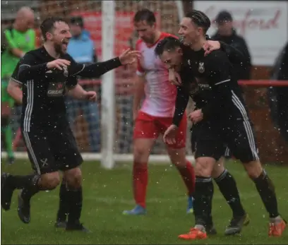  ??  ?? The Pollok players celebrate after recording a 4-1 win in blustery conditions at Brig O’Lea